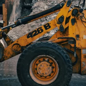 Close-up view of an Ash Skip Hire front loader truck in Northwich, highlighting its detailed design and sturdy construction for waste management.